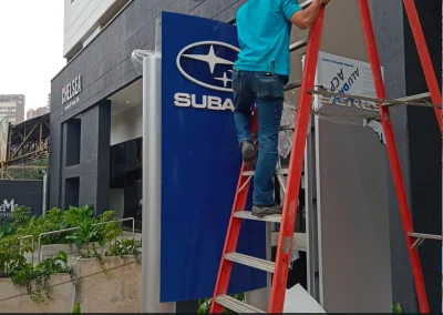 Sign installation Ottawa wall mounting brackets facade mounting commercial