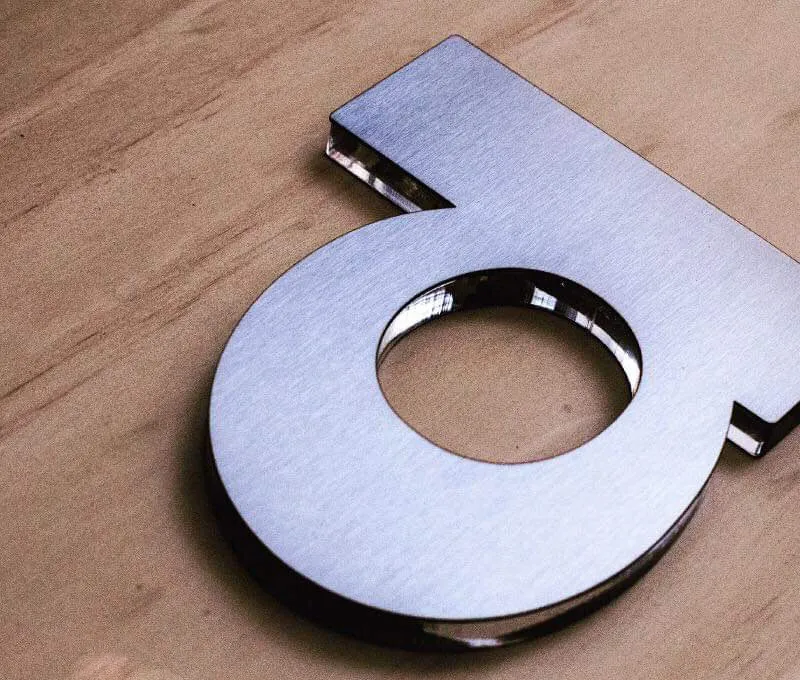 Brushed aluminum lobby sign Ottawa law firm — DSign LED