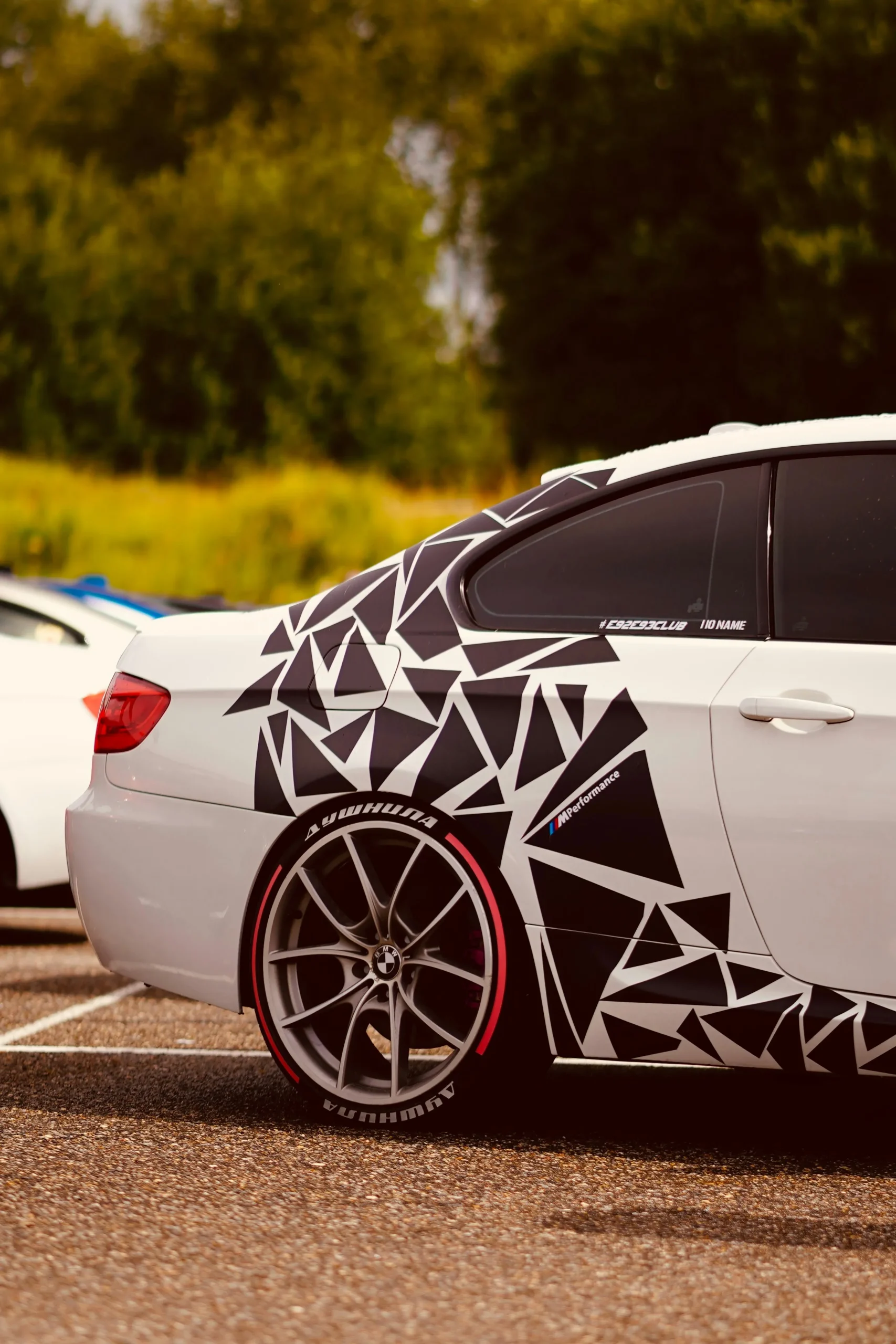 Custom geometric black and white vehicle wrap on BMW installed by DSign LED Ottawa